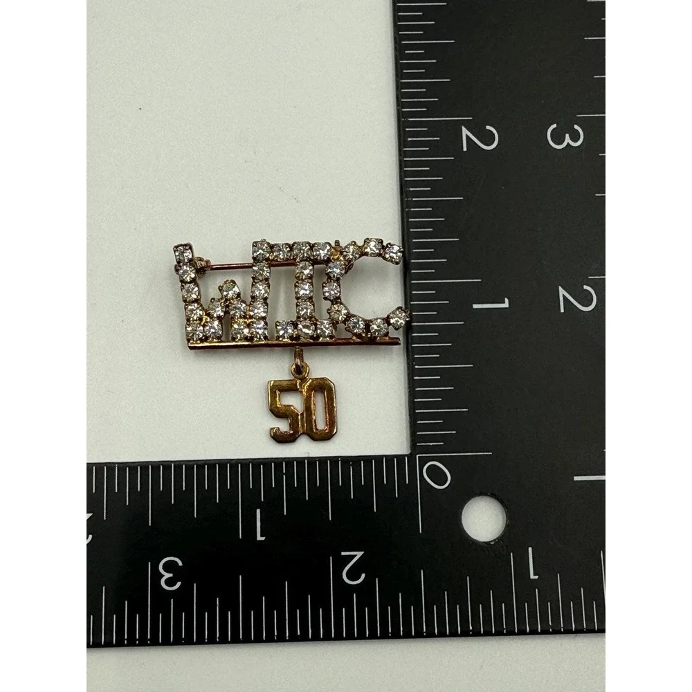 WIC 50 Rhinestone Brooch Gold Tone Anniversary Pin Dangle Charm